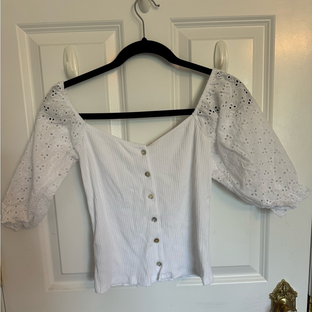 White shirt with buttons and crochet sleeves